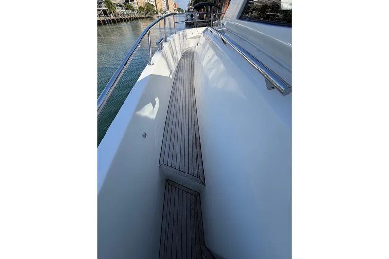 Veloce Yacht Photos Pics Side deck of 2017 Azimut Verve 40 yacht with wooden flooring and railing.