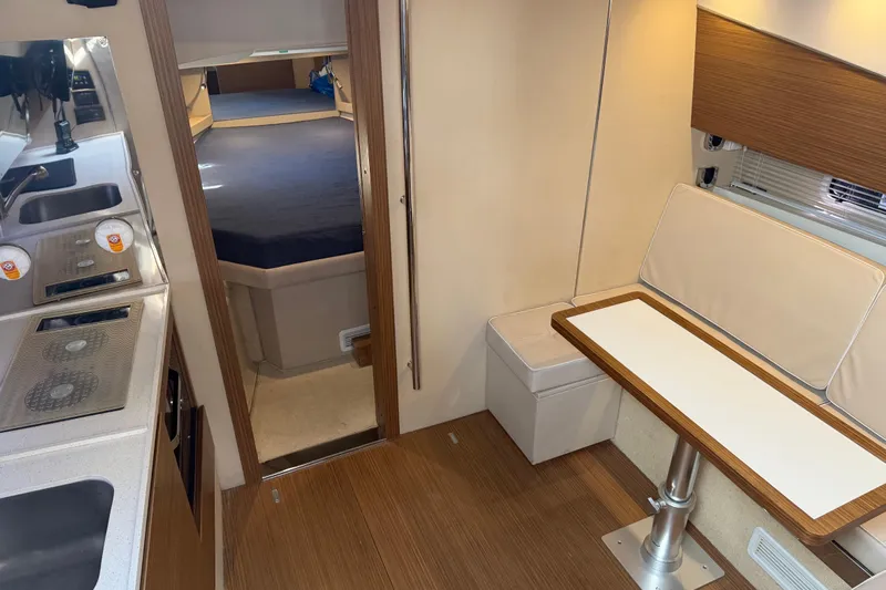 Veloce Yacht Photos Pics Interior of 2017 Azimut Verve 40 yacht with kitchen and seating area.