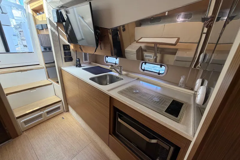 Veloce Yacht Photos Pics 2017 Azimut Verve 40 yacht interior kitchen with modern appliances and sleek design.
