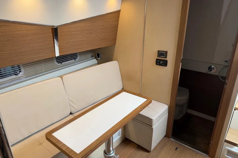Veloce Yacht Photos Pics Interior of 2017 Azimut Verve 40 yacht with seating and bathroom area.