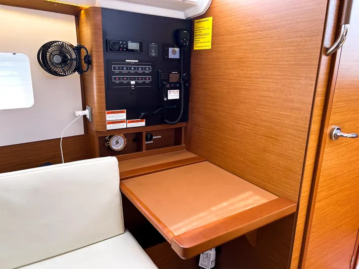 Soca Sleigh Yacht Photos Pics 2024 Jeanneau Sun Odyssey 380 interior with navigation station and control panel.