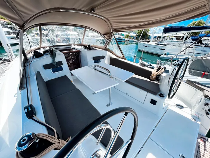 Soca Sleigh Yacht Photos Pics 2024 Jeanneau Sun Odyssey 380 yacht cockpit with dual steering wheels and seating area.