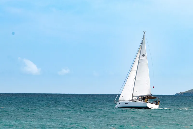 Soca Sleigh Yacht Photos Pics 2024 Jeanneau Sun Odyssey 380 sailing on open sea under clear blue sky.