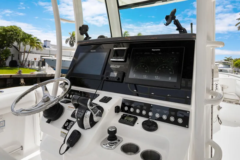  Yacht Photos Pics Control panel of a 2014 Boston Whaler 320 Outrage boat with modern navigation equipment.