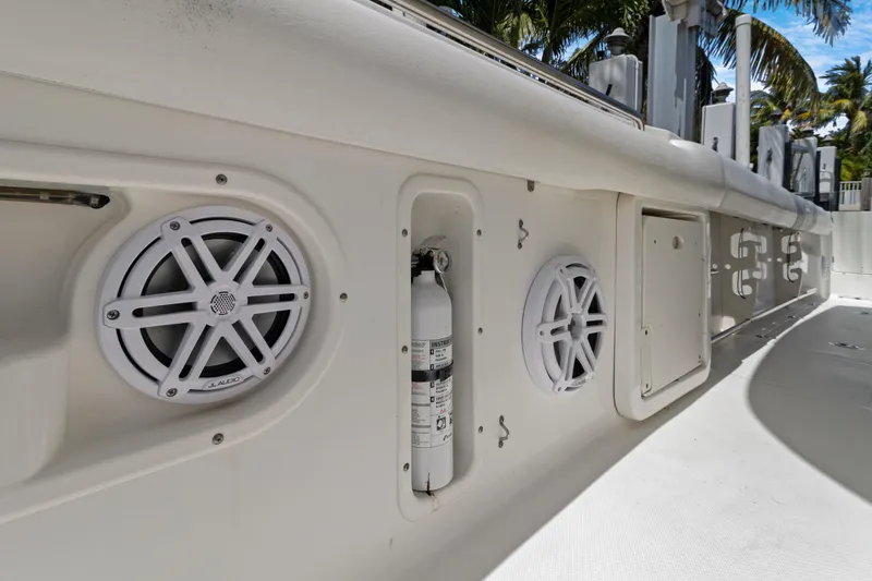  Yacht Photos Pics 2014 Boston Whaler 320 Outrage boat interior with speakers and fire extinguisher.