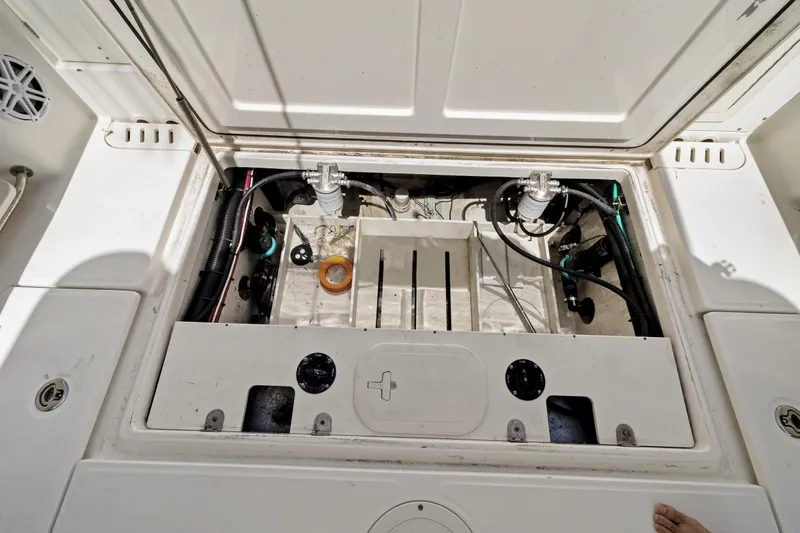  Yacht Photos Pics Open hatch of a 2014 Boston Whaler 320 Outrage, showing internal components and wiring.