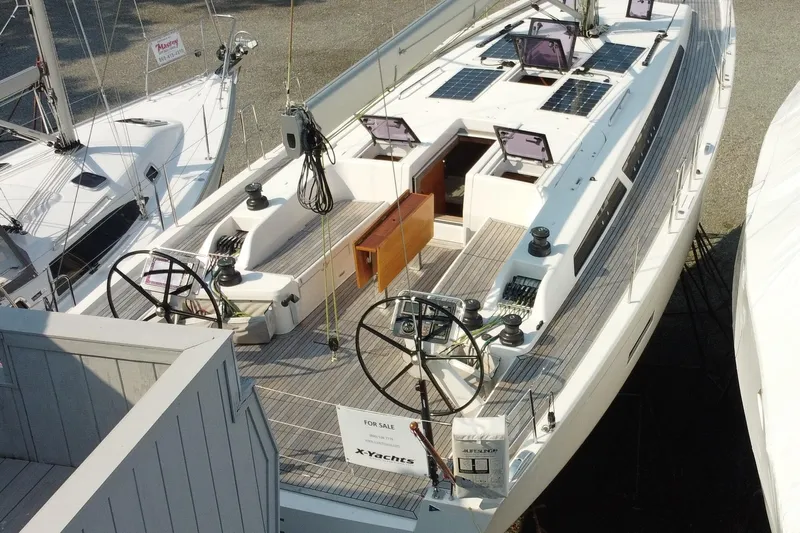 Abide Yacht Photos Pics 2018 X-Yachts X4.9 sailboat for sale, featuring dual steering wheels and spacious deck.