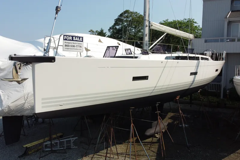 Abide Yacht Photos Pics 2018 X-Yachts X4.9 sailboat for sale, displayed on stands, with contact information visible.