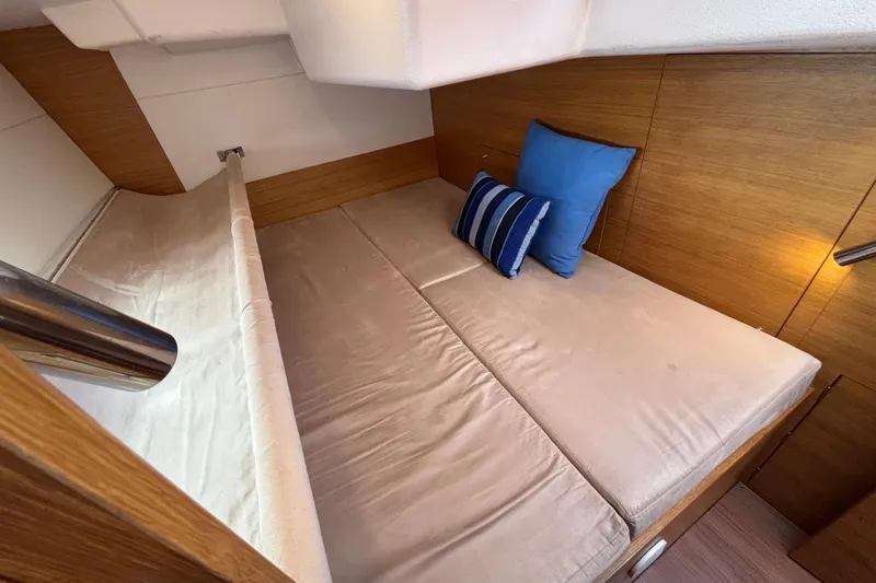Abide Yacht Photos Pics Luxurious cabin interior of 2018 X-Yachts X4.9 with cozy bedding and cushions.