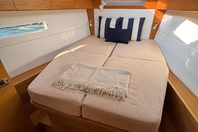 Abide Yacht Photos Pics Luxurious cabin interior of 2018 X-Yachts X4.9 with cozy bed and pillows.