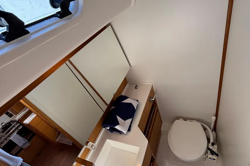 Abide Yacht Photos Pics Bathroom interior of 2018 X-Yachts X4.9, featuring modern fixtures and wooden accents.