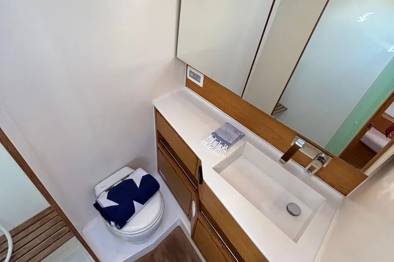 Abide Yacht Photos Pics Modern bathroom in 2018 X-Yachts X4.9, featuring sleek sink and compact toilet.