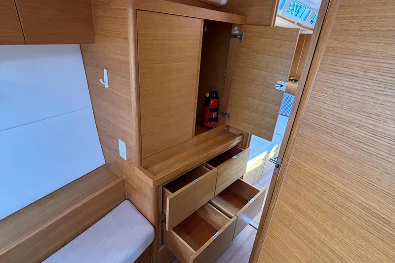 Abide Yacht Photos Pics Interior of 2018 X-Yachts X4.9 showing wooden cabinetry and storage drawers.