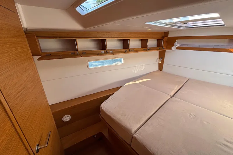 Abide Yacht Photos Pics Luxurious cabin interior of 2018 X-Yachts X4.9 with wooden finish and skylight.