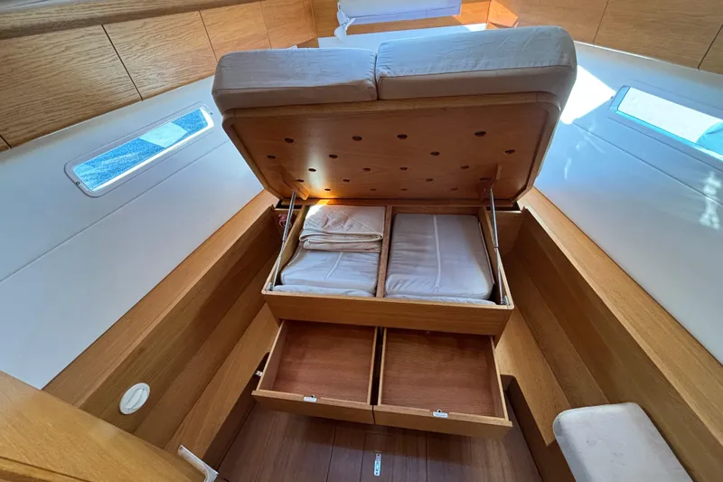 Abide Yacht Photos Pics 2018 X-Yachts X4.9 interior with open storage under bed, wooden finish.