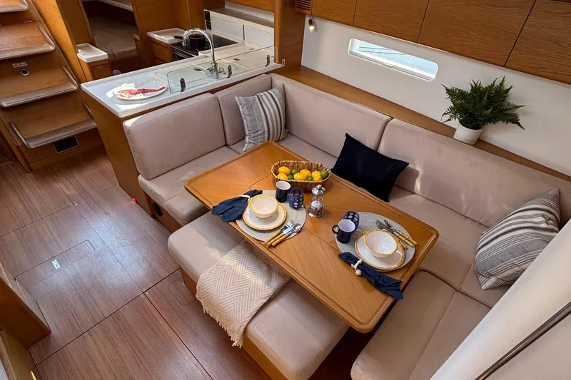 Abide Yacht Photos Pics Luxurious 2018 X-Yachts X4.9 interior with elegant dining setup and modern kitchen.