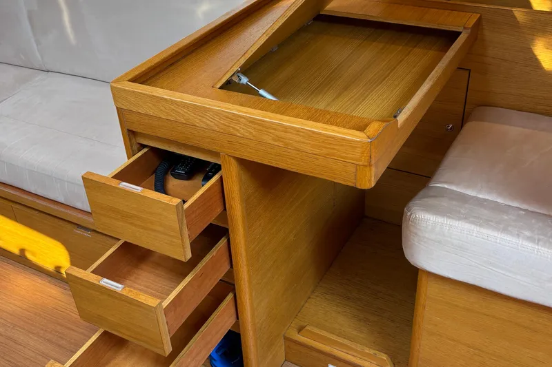 Abide Yacht Photos Pics Interior of 2018 X-Yachts X4.9 showing wooden drawers and seating area.