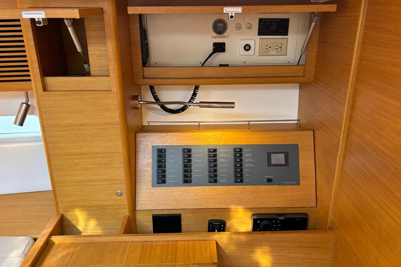 Abide Yacht Photos Pics Control panel of 2018 X-Yachts X4.9 sailboat with wooden interior design.
