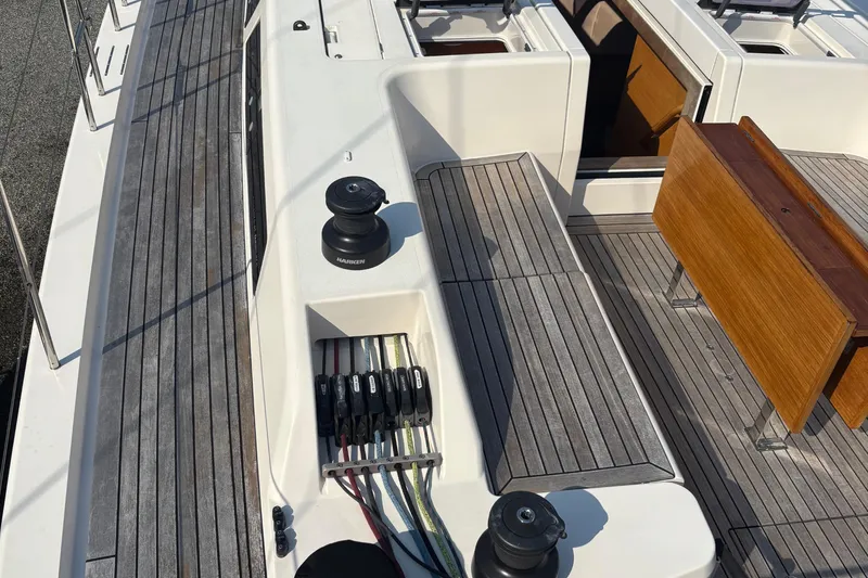 Abide Yacht Photos Pics 2018 X-Yachts X4.9 deck with winches, ropes, and wooden seating.