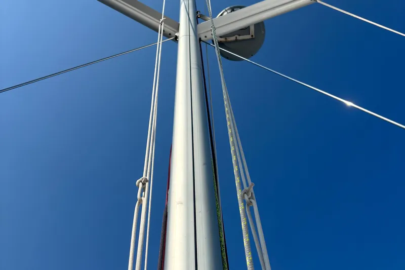 Abide Yacht Photos Pics Mast and rigging of 2018 X-Yachts X4.9 sailboat against clear blue sky.