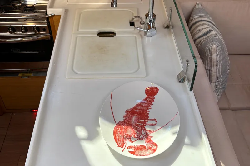 Abide Yacht Photos Pics Galley of 2018 X-Yachts X4.9 with lobster plate, sink, and stove.