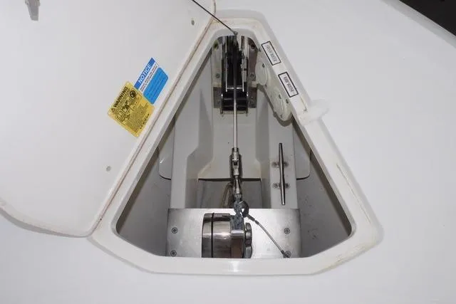  Yacht Photos Pics 2019 Pursuit OS 325 Offshore anchor locker with open hatch and visible winch system.