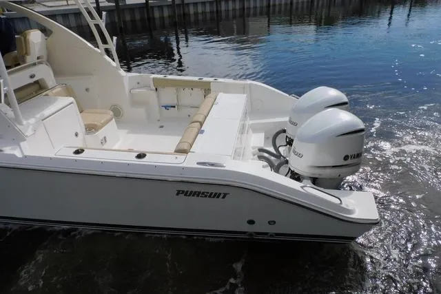  Yacht Photos Pics 2019 Pursuit OS 325 Offshore boat with twin Yamaha engines on calm water.