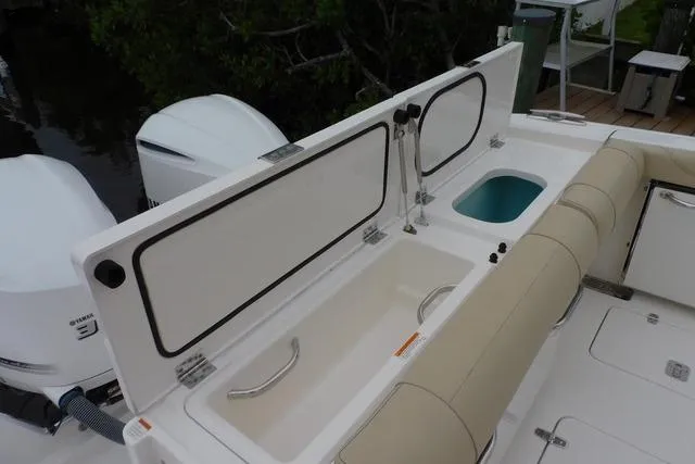  Yacht Photos Pics 2019 Pursuit OS 325 Offshore boat deck with storage compartments and seating.
