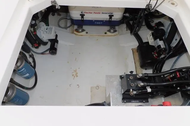  Yacht Photos Pics Engine compartment of 2019 Pursuit OS 325 Offshore boat with visible generator and components.
