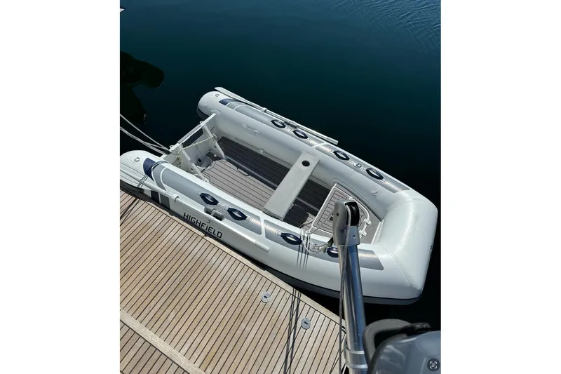 Run For The Roses Yacht Photos Pics Inflatable dinghy docked beside a 2019 Beneteau Oceanis 46.1 yacht.