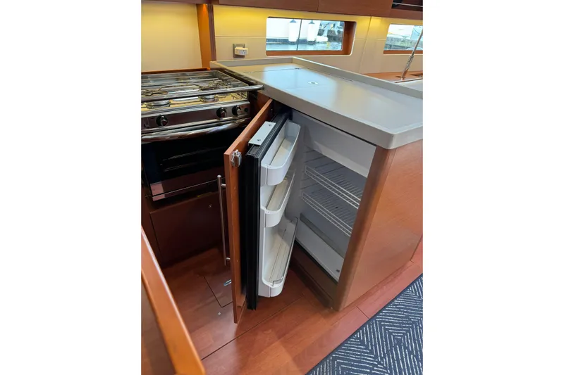 Run For The Roses Yacht Photos Pics Modern kitchen in 2019 Beneteau Oceanis 46.1 yacht with open fridge and stove.