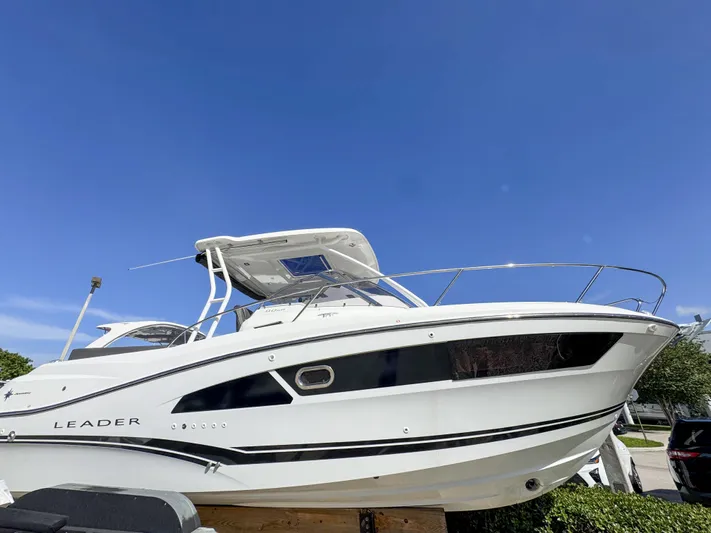 Mi Caleta Yacht Photos Pics 2023 Jeanneau Leader 9.0 WA boat under clear blue sky.