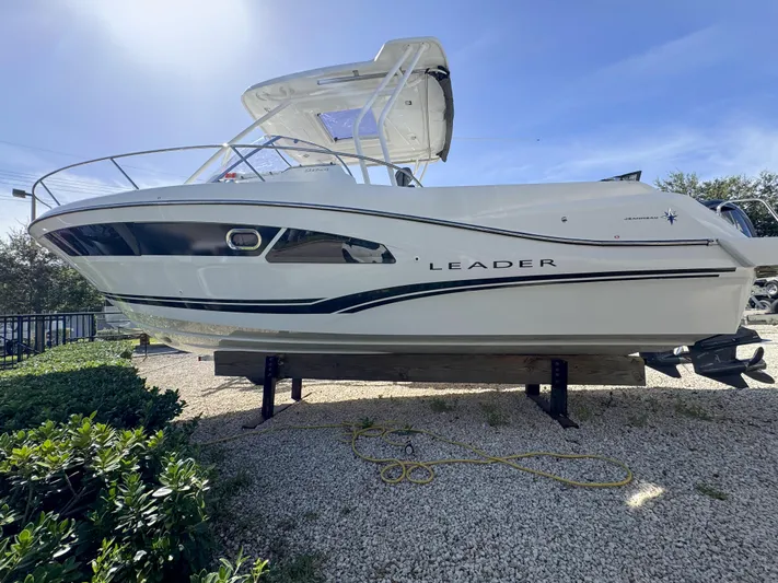 Mi Caleta Yacht Photos Pics 2023 Jeanneau Leader 9.0 WA boat displayed outdoors on gravel.