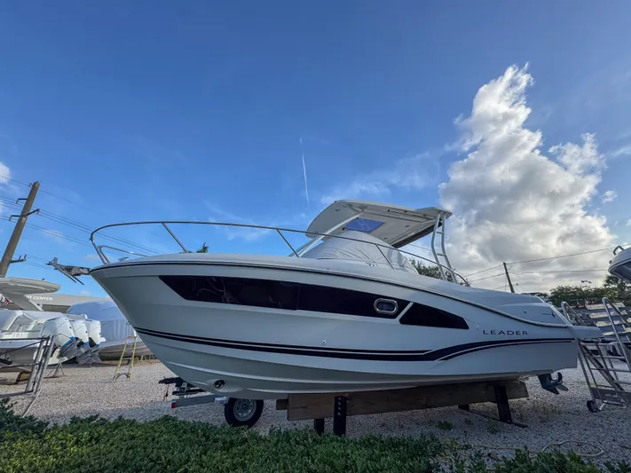 Mi Caleta Yacht Photos Pics 2023 Jeanneau Leader 9.0 WA boat displayed outdoors under a clear blue sky.