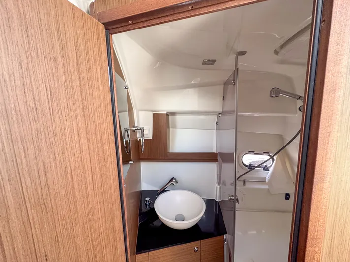 Mi Caleta Yacht Photos Pics 2023 Jeanneau Leader 9.0 WA bathroom with modern sink and shower.