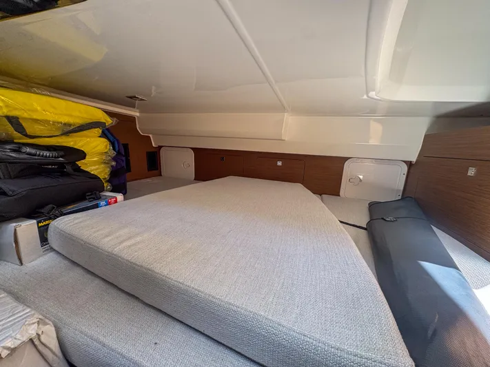 Mi Caleta Yacht Photos Pics Interior cabin of 2023 Jeanneau Leader 9.0 WA with storage and cushions.