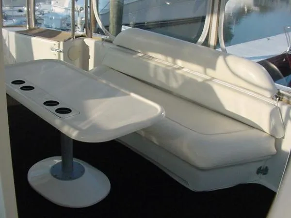  Yacht Photos Pics 2001 Sea Ray 420 Aft Cabin interior with white seating and table, featuring cup holders.