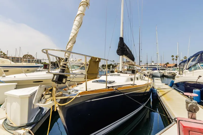 Kamala Yacht Photos Pics Tartan 3700 sailboat, 2003 model, docked in a marina under clear skies.