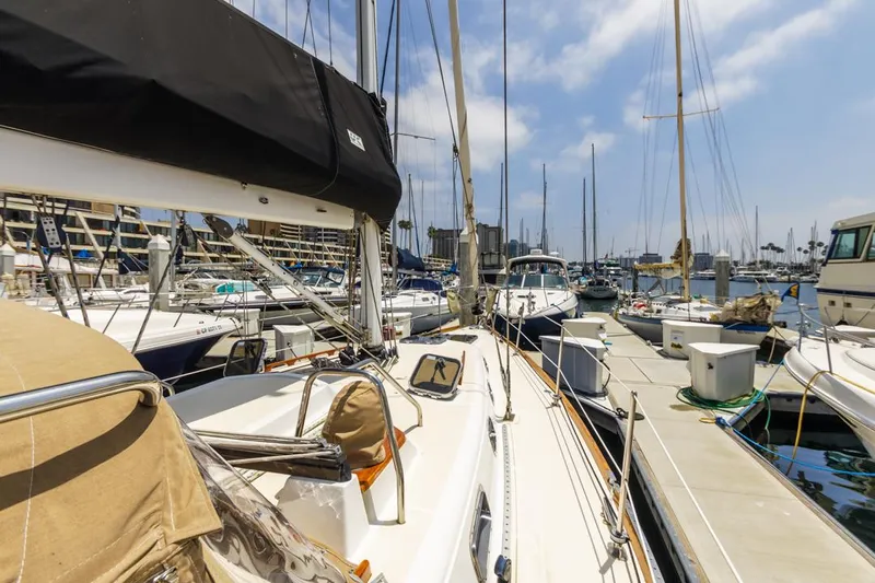 Kamala Yacht Photos Pics Sailboats docked at a marina, featuring a 2003 Tartan 3700 under a clear sky.