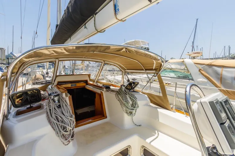 Kamala Yacht Photos Pics Sailboat cockpit of 2003 Tartan 3700, docked in a sunny marina.