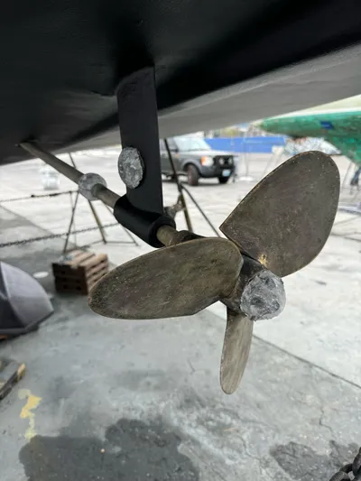 Kamala Yacht Photos Pics Close-up of a Tartan 3700 sailboat propeller, 2003 model, in a boatyard setting.