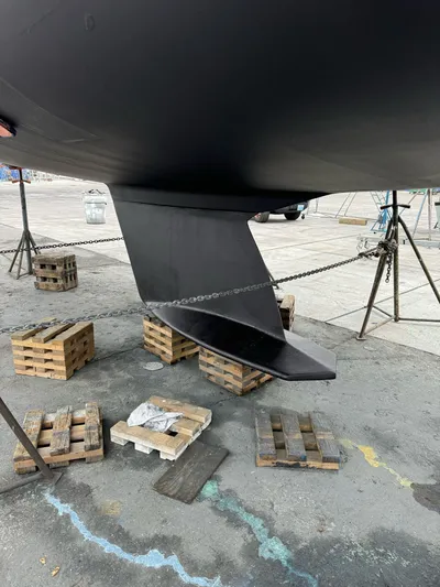 Kamala Yacht Photos Pics Tartan 3700 sailboat keel, 2003 model, on dry dock with wooden supports.