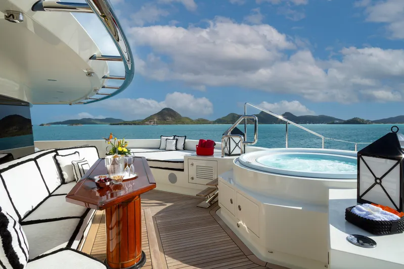 Alfa Nero Yacht Photos Pics Luxurious Oceanco 269' yacht deck with hot tub, elegant seating, and ocean view, 2007 model.