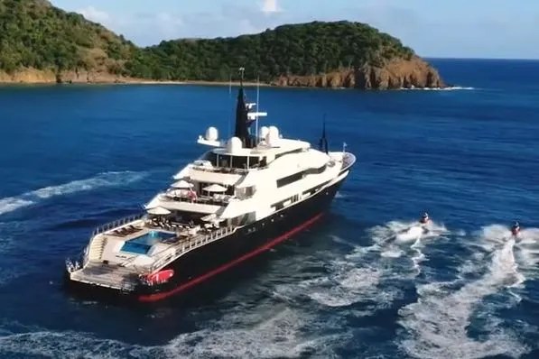 Alfa Nero Yacht Photos Pics Luxurious 2007 Oceanco 269' yacht cruising near scenic island with jet skis.