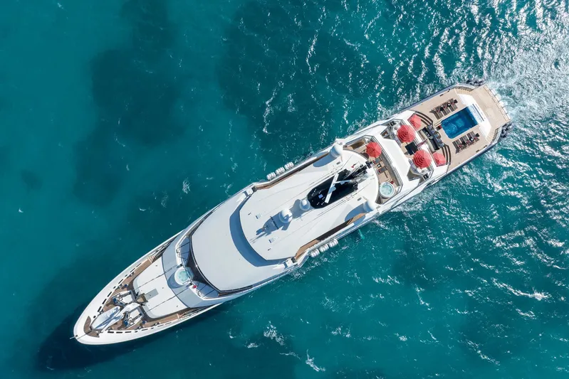 Alfa Nero Yacht Photos Pics Aerial view of 2007 Oceanco 269' yacht cruising in clear blue waters.