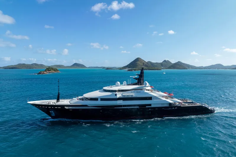 Alfa Nero Yacht Photos Pics Luxurious 2007 Oceanco 269' yacht cruising in clear blue waters with scenic island backdrop.