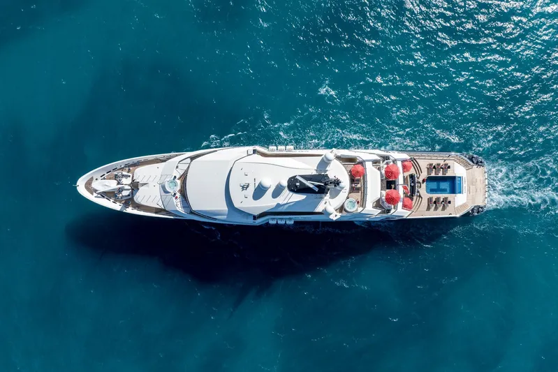 Alfa Nero Yacht Photos Pics Aerial view of 2007 Oceanco 269' yacht cruising in blue ocean waters.