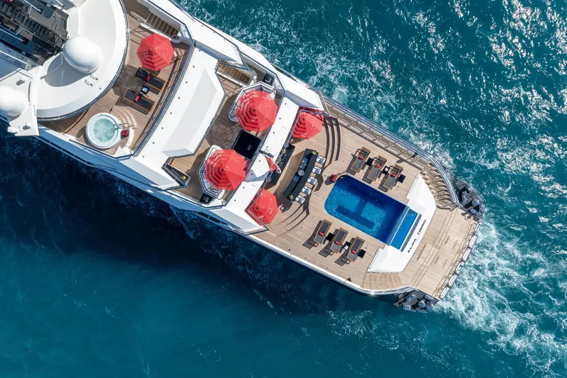 Alfa Nero Yacht Photos Pics Aerial view of 2007 Oceanco 269' yacht with pool and red umbrellas on deck.