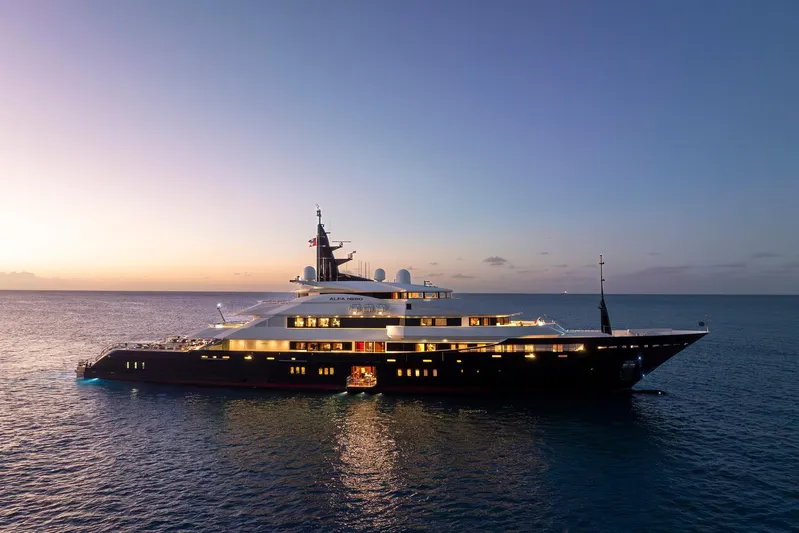 Alfa Nero Yacht Photos Pics Luxurious 2007 Oceanco 269' yacht at sunset on the ocean.