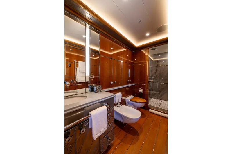 Alfa Nero Yacht Photos Pics Luxurious yacht bathroom with wood paneling, modern fixtures, and elegant lighting, Oceanco 269', 2007.
